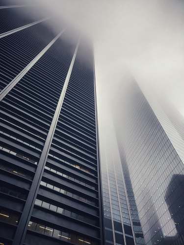building low angle photography of concrete buildings high rise