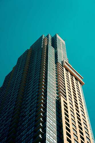 building low angle photography of high rise building under blue sky high rise