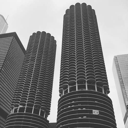 black-and-white low angle photography of high-rise buildings architecture