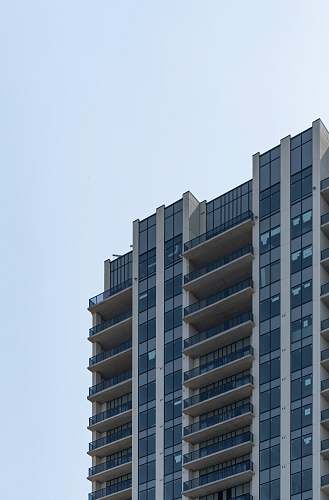 building low-angle photography of white high-rise building urban