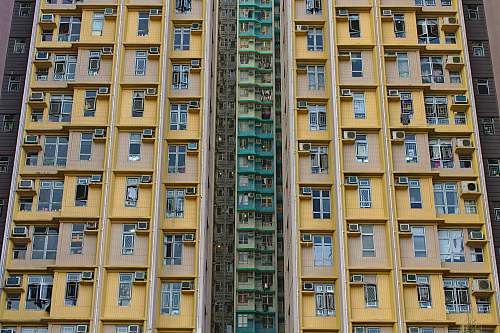 building low-angle photography of yellow concrete building high rise