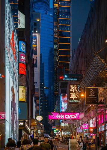 urban people in busy city street at night building