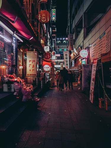 urban people walking between buildings town