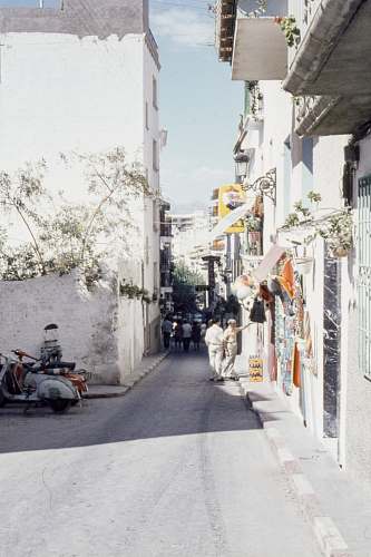 urban people walking on road near buildings road