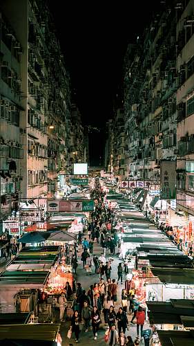 building people walking on the streets between buildings metropolis
