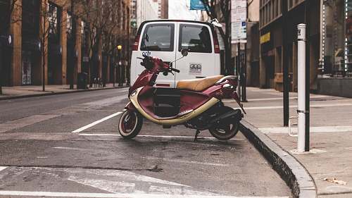 transportation red and beige motor scooter scooter