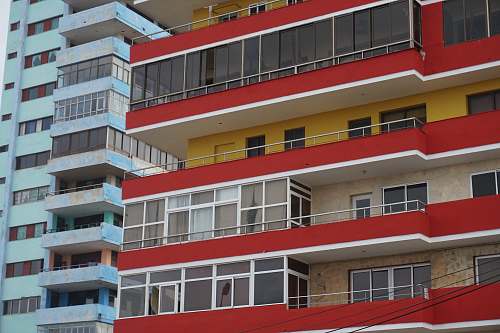 building red and white buildings high rise