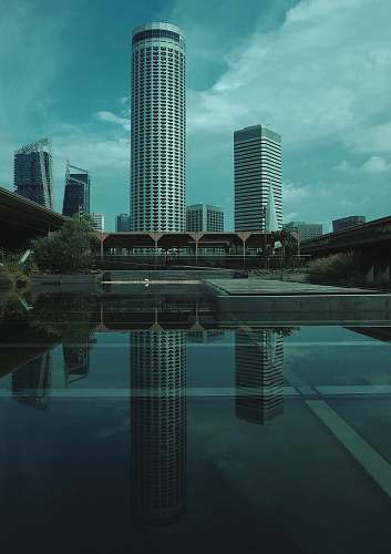 building reflection of high rise buildings on mirror floor town