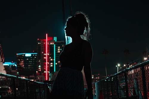 building silhouette photography of woman urban