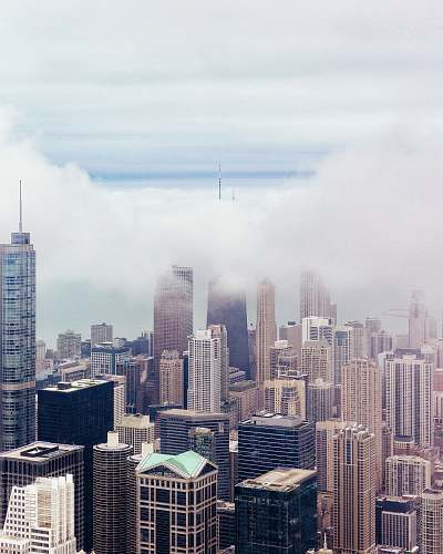 building skyscrapers under cloudy sky clouds