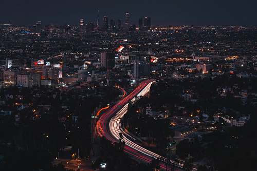road timelapse photo of cityscape with lights urban