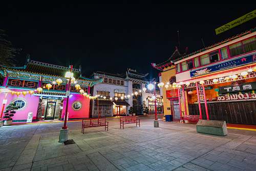 building turned-on lanterns on street downtown