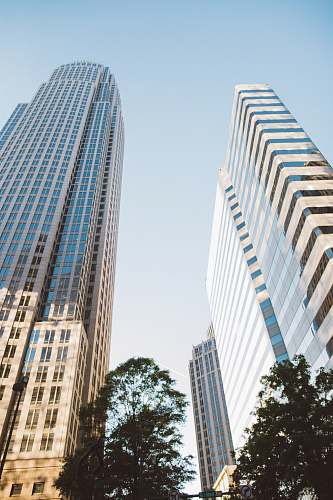 building two tall buildings during daytime office building