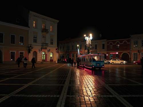 building white bus on road downtown