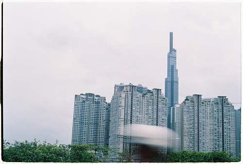 building white concrete high-rise building high rise