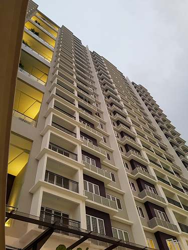 condo white concrete high-rise buildings housing