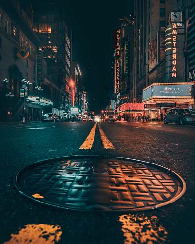 urban worm's eye view of sewer lid street