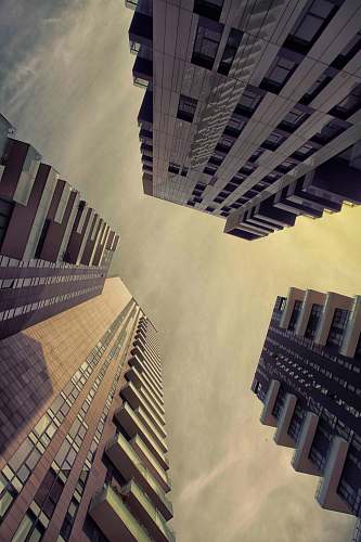 building worm's eye view photography of three high-rise buildings high rise