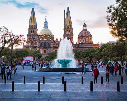 town people near water fountain urban