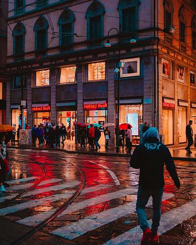 pedestrian people walk on the street near Foot Locker store person