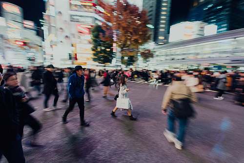 pedestrian people walking in city at night person