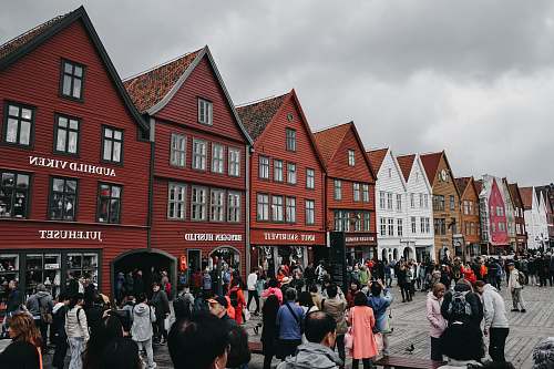 pedestrian row of brown and white buildings person