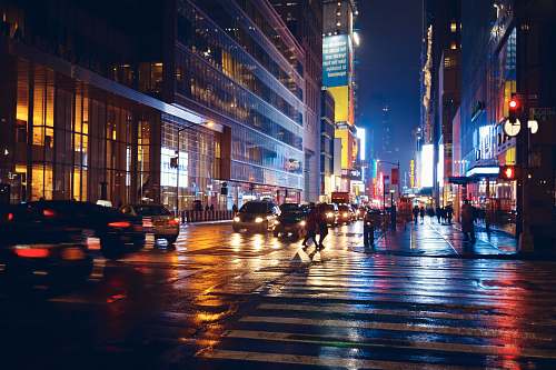 person time-lapse photography of people and vehicles on road pedestrian