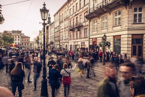 human people on road near building during daytime pedestrian