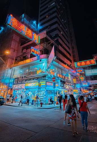 pedestrian people walking on street during night human