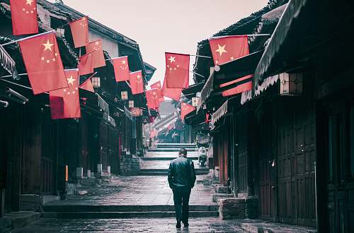 town man walking during daytime urban