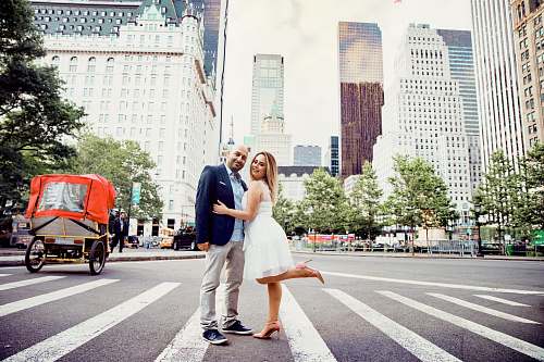asphalt woman and man standing on pedestrian lane tarmac