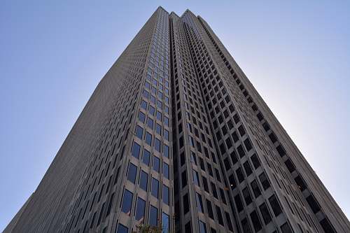 city brown high-rise building with clear blue skies building