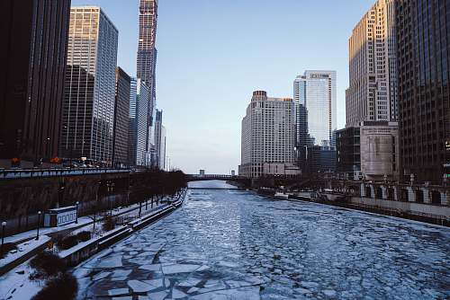 city body of water with buildings on side building