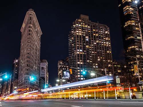 downtown flat iron building time lapse photography urban