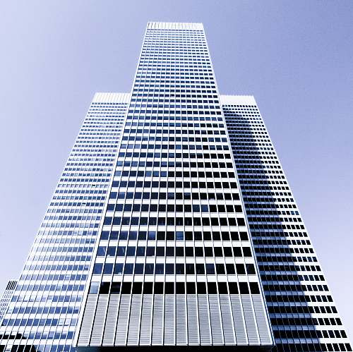 city A tall white skyscraper on a bright day in Montreal building