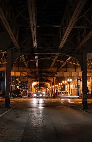 road brown concrete building during night time street