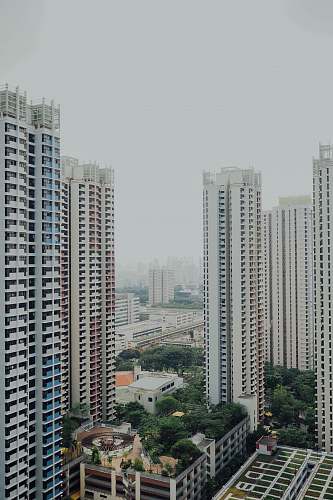 town high-rise buildings under white sky building