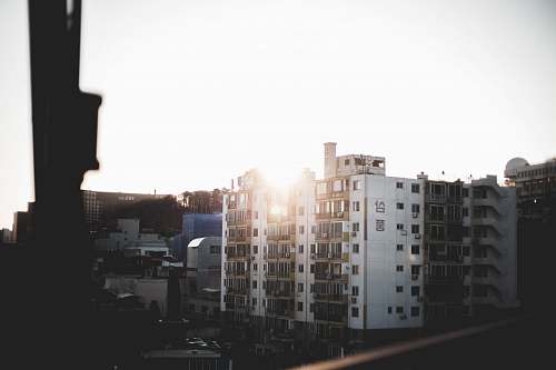city white buildings under white sky building