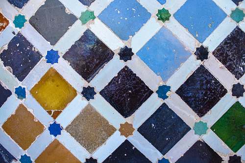 spain teal, purple, and brown tile rug