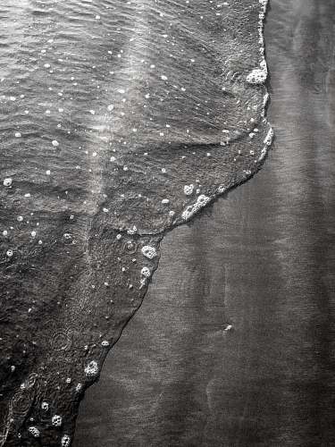 black-and-white seashore during day uk