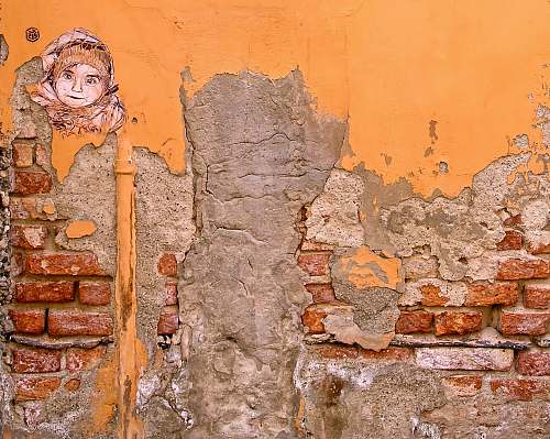 person closeup photo of orange and gray wall paint people