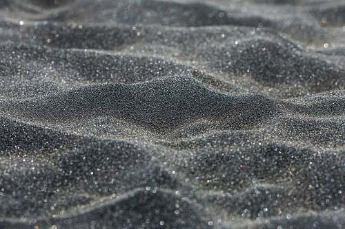 black-and-white brown sand with water droplets sand