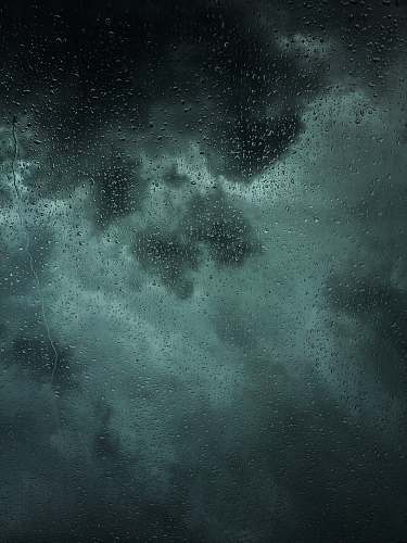 grey dew drops on glass panel rain