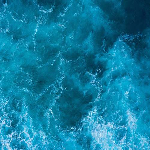 sea high angle photo of blue water water