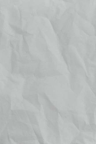 grey white printer paper on brown wooden table black-and-white