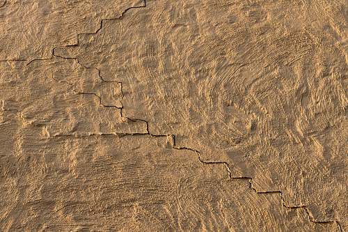texture brown sand with heart shaped ground