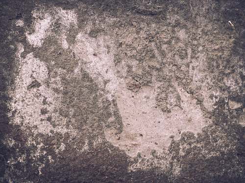 rock aerial photography of green field concrete