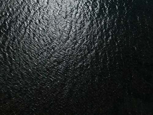 grey black leather textile in close up photography rug