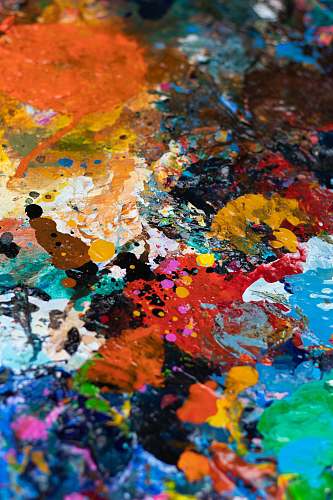 art blue, white, orange, and red abstract painting paint container