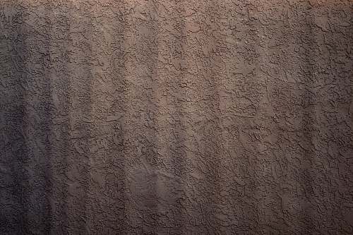 grey brown and white floral textile  stucco